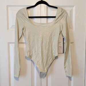 Lululemon Athletica Shimmering Cream Bodysuit